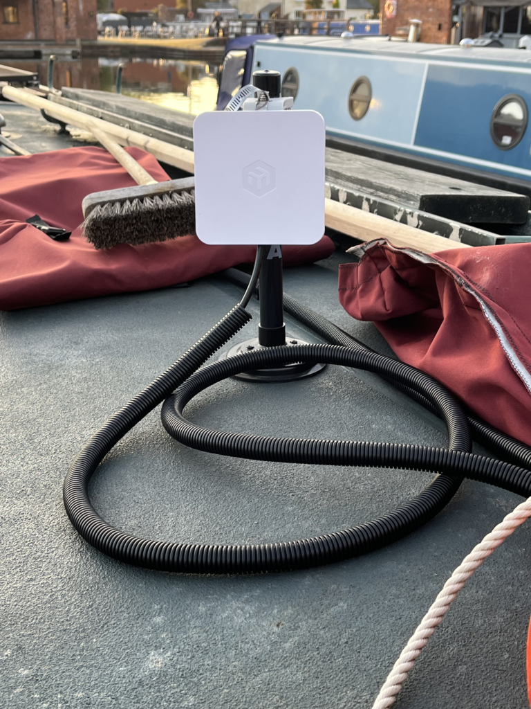 MikroTik Wi-Fi receiver on a magnetic pole with a cable loop on Rasmunda's roof